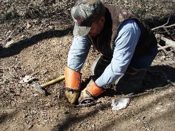 1) Excavate the area to place the foothold trap.