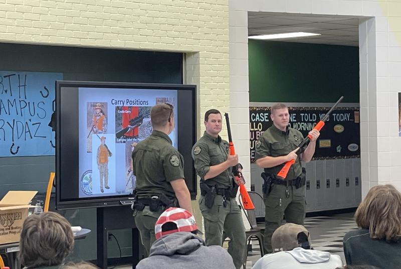 Hunter education demonstration of rifle carry position